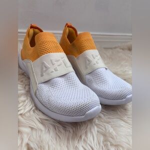 APL TechLoom Bliss Slip-On Sneakers in Orange and White